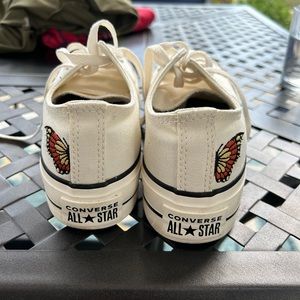 Converse custom sneaker with butterfly detail.
